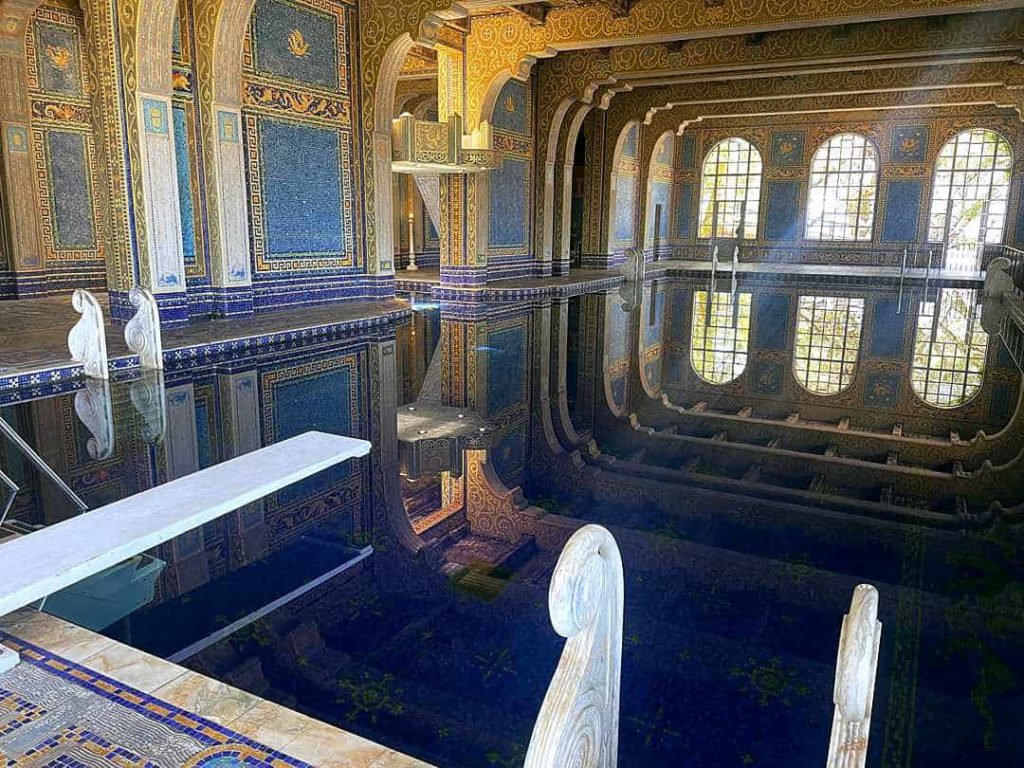 The indoor Roman Pool at Hearst Castle with marble and ornate mosaic tile.